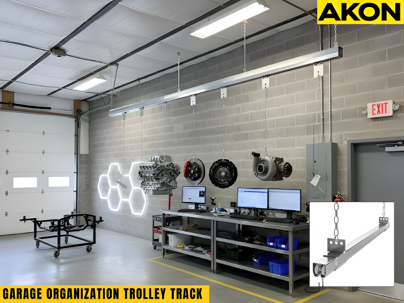 Garage organization trolley track system with engine components suspended from a ceiling-mounted steel rail in a workshop setting.