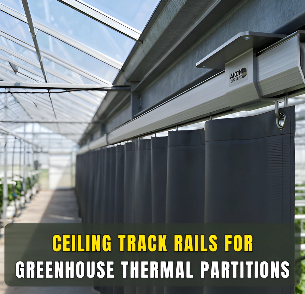 Ceiling track rails for greenhouse thermal partitions supporting sliding curtain system inside commercial greenhouse.
