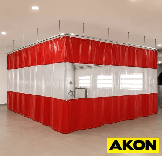 Industrial curtain track system installed in a paint booth to divide or enclose the spray area.